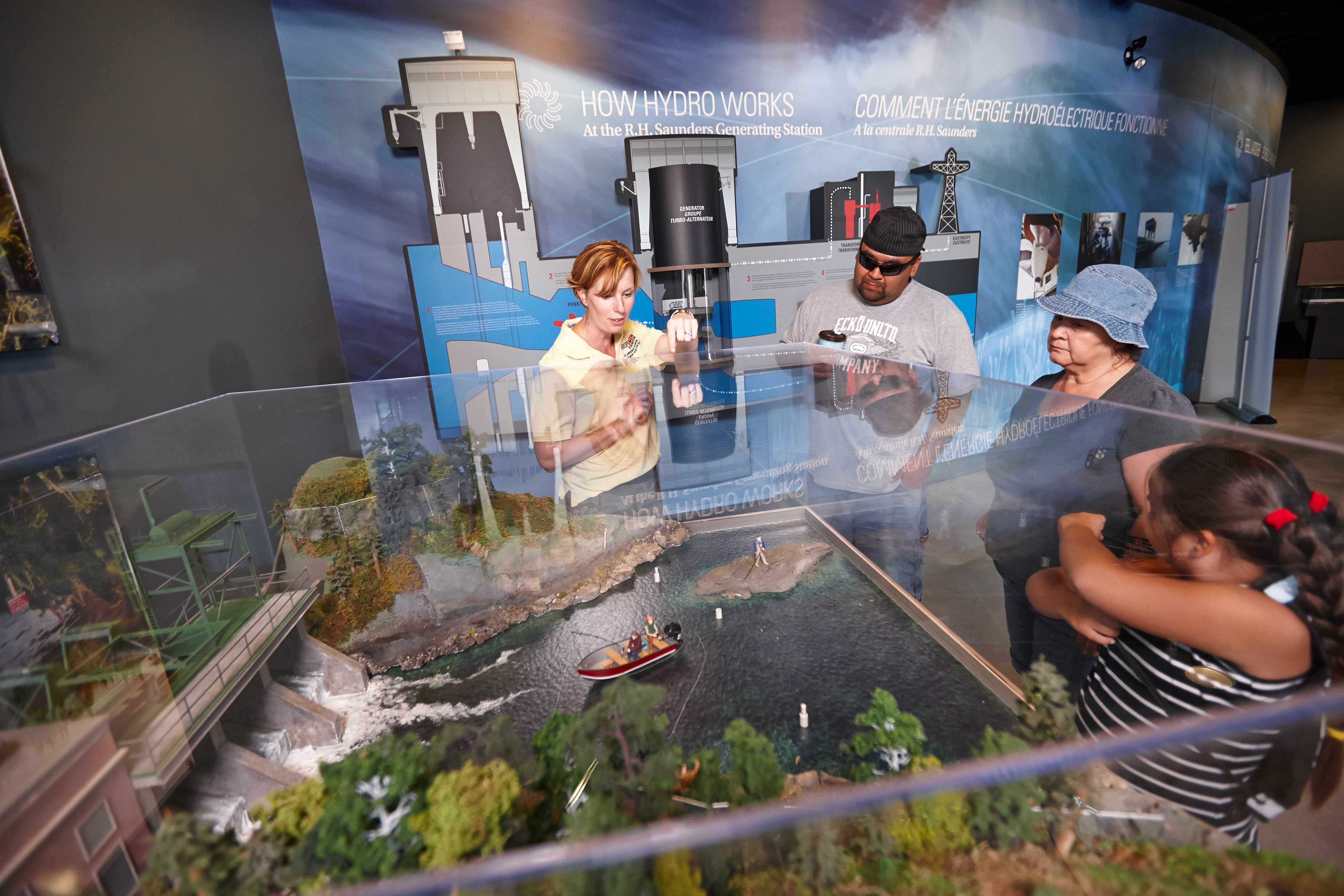 An OPG staff member demonstrates a water safety exhibit.