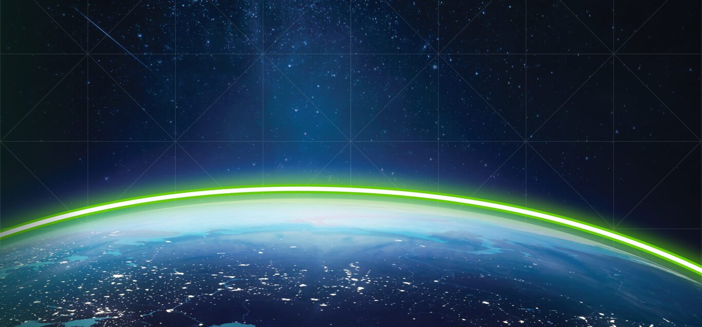 A green energy line crests the horizon of the Earth seen from space.