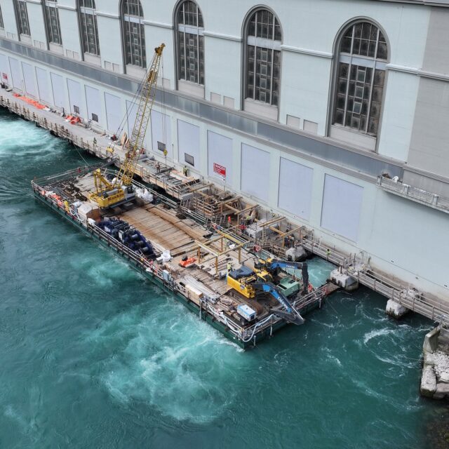 Using a sectional barge, workers dismantled the old tailrace deck at OPG's Sir Adam Beck I hydro station before constructing a new, wider deck and related upgrades.